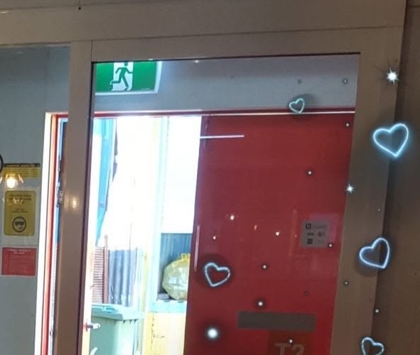 The original red door at our Cloncurry café — where the RedDoor name began